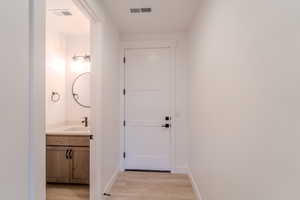 Bathroom featuring hardwood / wood-style floors and vanity