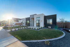 Modern home featuring a front yard