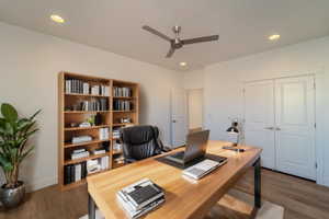 Office area featuring ceiling fan and hardwood / wood-style flooring