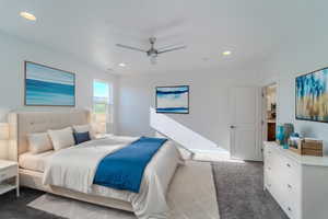 Carpeted bedroom with ceiling fan