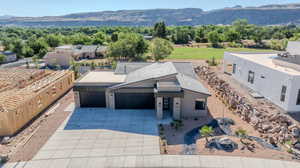 Birds eye view of property with a mountain view