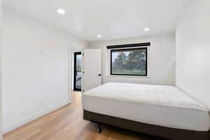 Bedroom featuring light wood-type flooring