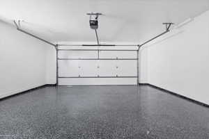 Garage featuring a garage door opener