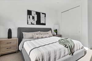 Bedroom with carpet floors and a closet