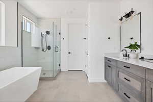 Bathroom with independent shower and bath and vanity