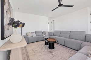 Living room featuring ceiling fan