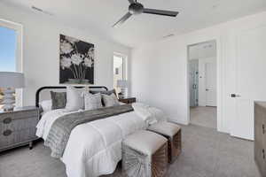 Bedroom with light carpet and ceiling fan