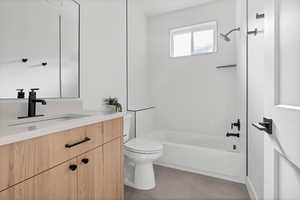 Full bathroom featuring vanity, tile patterned flooring, toilet, and shower / bath combination