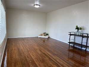 Spacious living room with hardwood floors and double pane windows