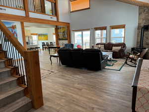 Family room with LVP floors and high vaulted ceiling