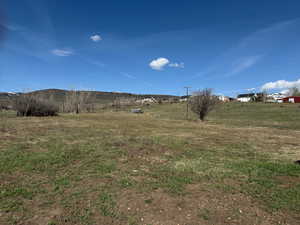 View of yard with a rural view