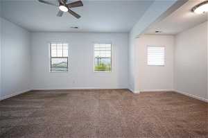 Primary bedroom, with ceiling fan and carpet