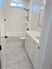Full bathroom featuring vanity, tile flooring, bathtub / shower combination, and toilet