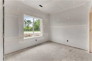 Spare room with concrete floors