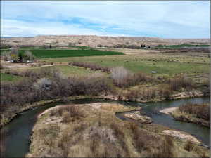 Aerial view featuring a water and mountain view