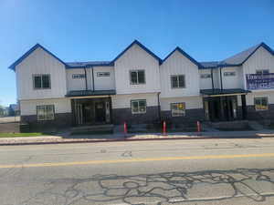 View of front of property with central AC unit