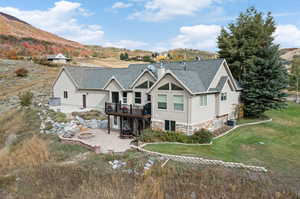 Back of property with a mountain view