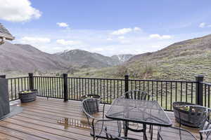 Wooden deck featuring a mountain view