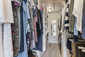 Spacious closet with carpet floors