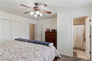 Bedroom featuring a closet, tile flooring, and ceiling fan
