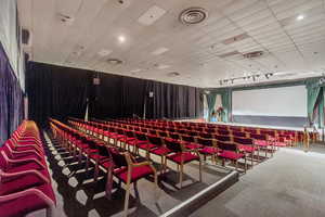 Home theater room featuring carpet