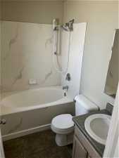 Full bathroom featuring tile flooring, shower / tub combination, vanity, and toilet