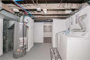 Interior space featuring independent washer and dryer and water heater