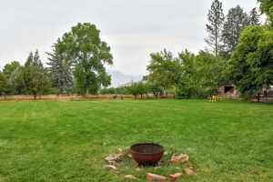 View of yard with a fire pit