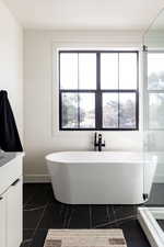 Bathroom featuring vanity and tile floors