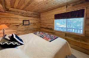 Bedroom with wood ceiling