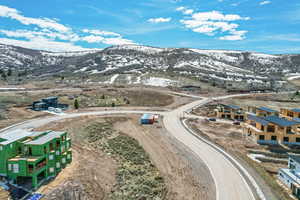 Birds eye view of property with a mountain view