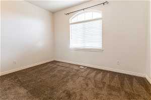 Bedroom with a healthy amount of sunlight and carpet flooring