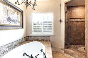 Master Bathroom featuring tile floors and jetted tub and walk in shower