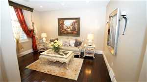 Formal living room or office space featuring dark engineering hardwood floors