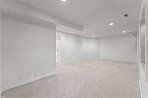 Basement featuring light carpet and recessed lighting