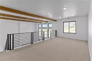 Carpeted spare room with beamed ceiling
