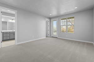 Spare room featuring light colored carpet