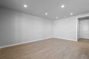 Unfurnished room with light hardwood / wood-style floors