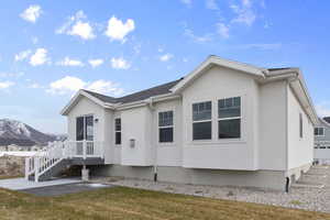 View of front of home featuring a mountain view