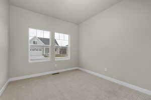 View of carpeted spare room