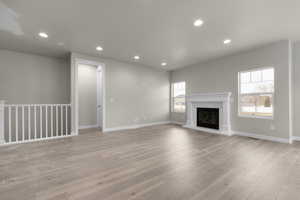 Unfurnished living room with light hardwood / wood-style floors