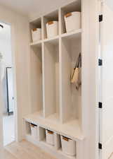 Mudroom featuring wood-type flooring