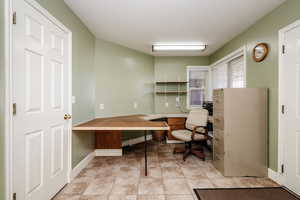 Office area with light tile floors