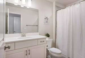 Bathroom featuring vanity and toilet