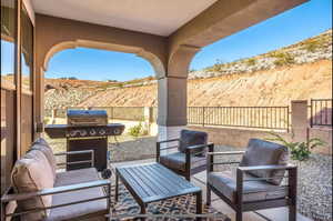 View of patio featuring area for grilling and an outdoor hangout area