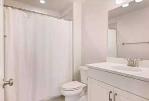 Bathroom with oversized vanity and toilet