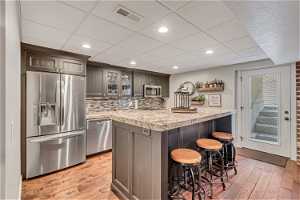 Full basement kitchen with stainless steel appliances