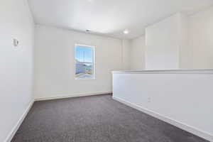 Unfurnished room featuring carpet flooring