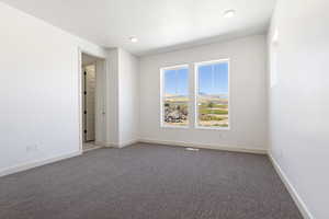 View of carpeted spare room