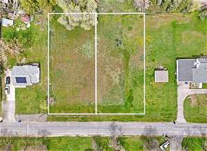 Lot 3 on the left, Lot 2 on the right. south facing, approximately 90 feet of frontage per lot.